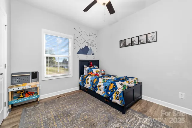 a bedroom with furniture and a window