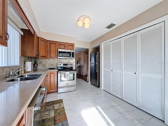 a living room with furniture and a rug
