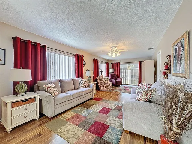 a living room with furniture fireplace and flat screen tv