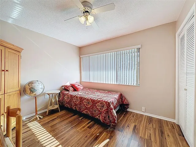 a view of walk in closet with wooden floor