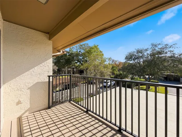 an aerial view of a house with a yard and garden
