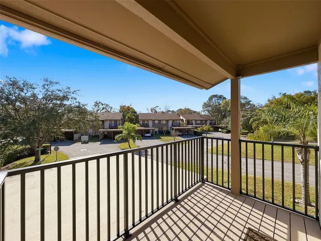 an aerial view of a houses with a yard