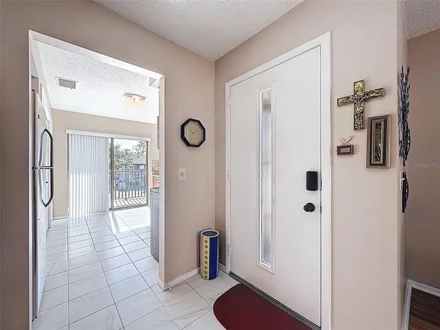 a kitchen with stainless steel appliances granite countertop a refrigerator stove and sink
