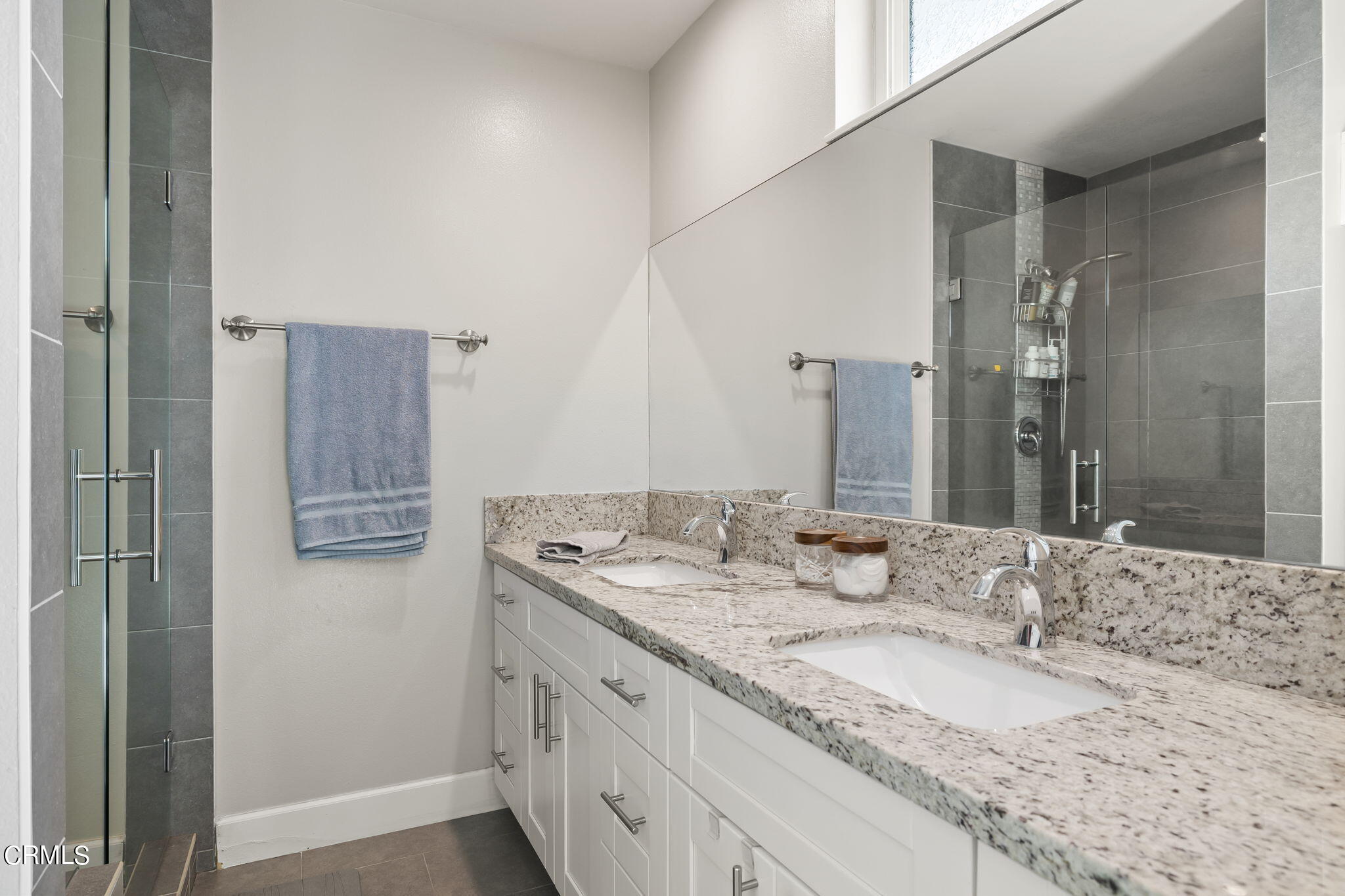 3575 Corby Avenue Camarillo, CA 93010 - Photo 21 of 36 a bathroom with a granite countertop double vanity sink and mirror