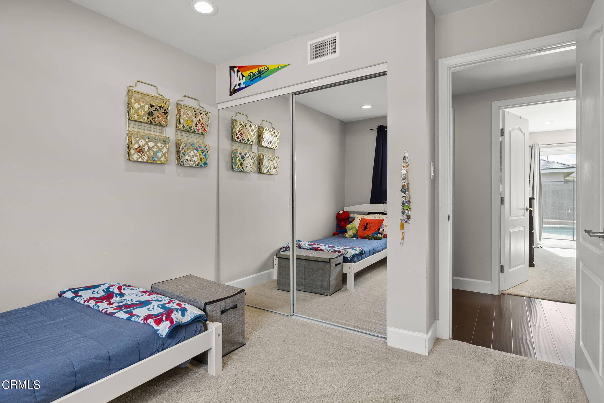 3575 Corby Avenue Camarillo, CA 93010 - Photo 24 of 36 a bedroom with a bed and cabinets