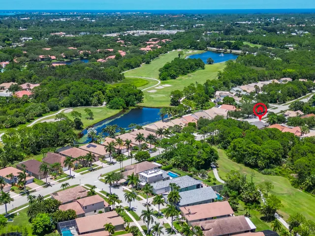 a aerial view of a house with a yard