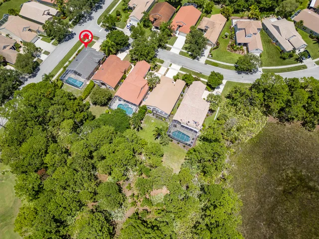 a kitchen with white cabinets stainless steel appliances and a sink