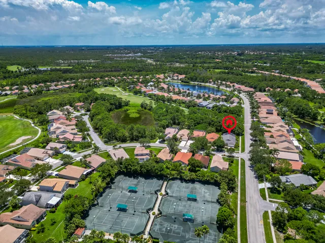 a bathroom with a sink double vanity granite tub and a mirror