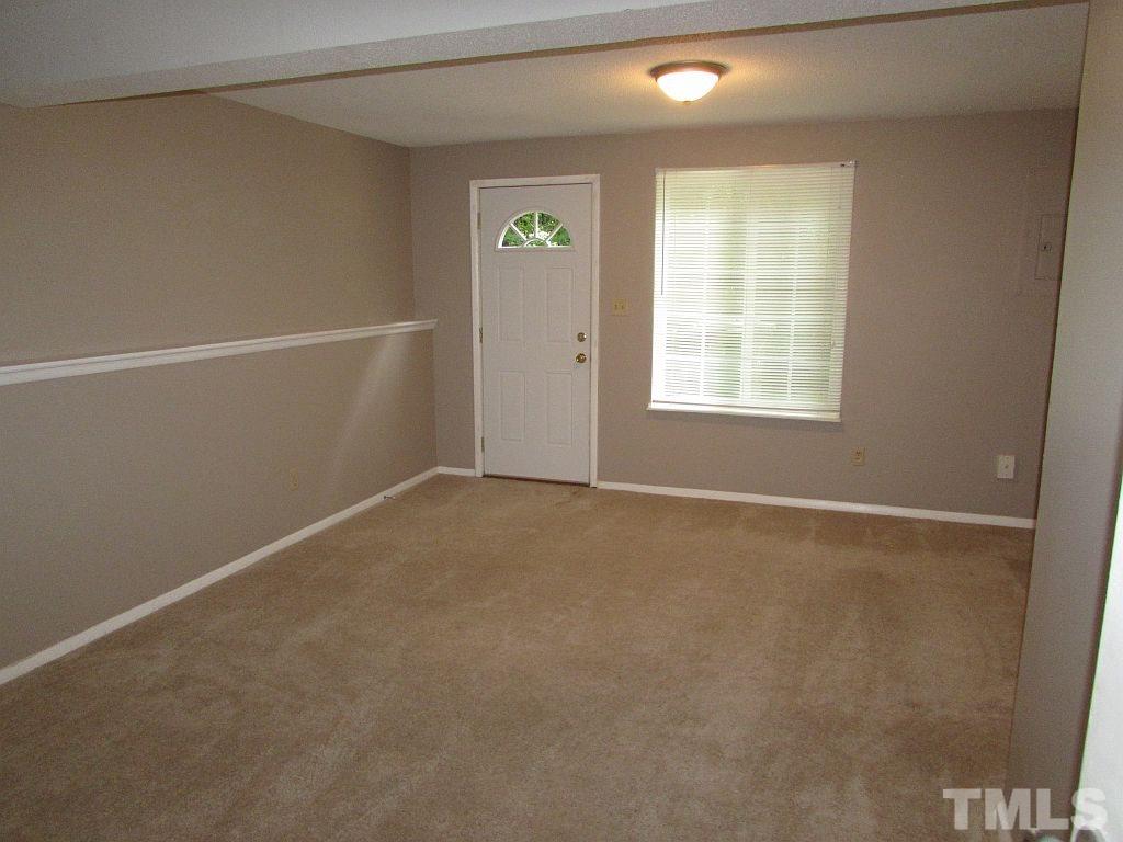 7711 Kelley Court Raleigh, NC 27615 - Photo 5 of 11 an empty room with windows