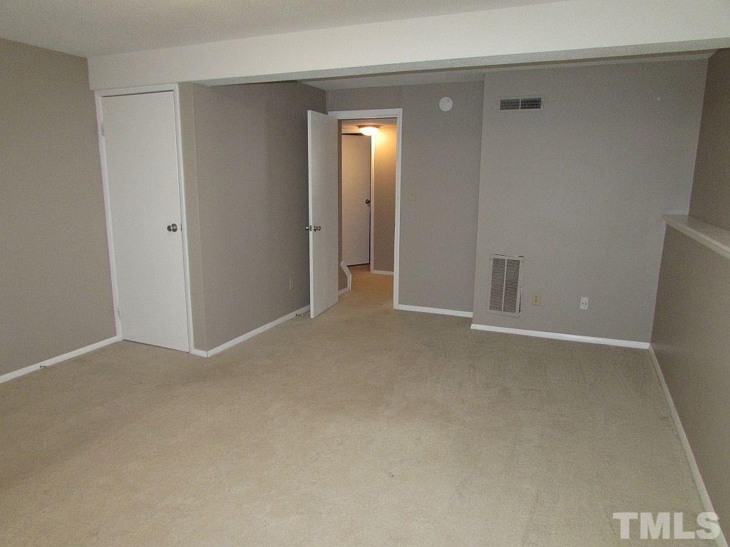 7711 Kelley Court Raleigh, NC 27615 - Photo 6 of 11 a view of an empty room