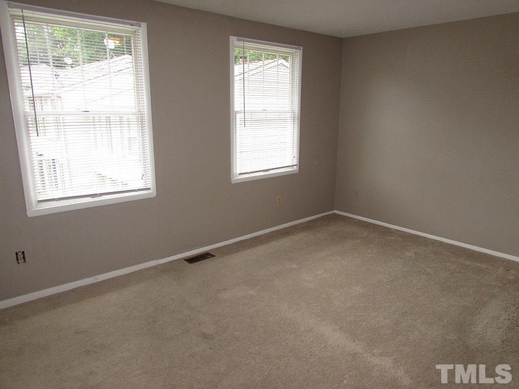 7711 Kelley Court Raleigh, NC 27615 - Photo 8 of 11 an empty room with a window