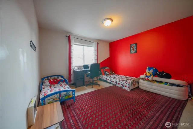 a bedroom with furniture and a bed