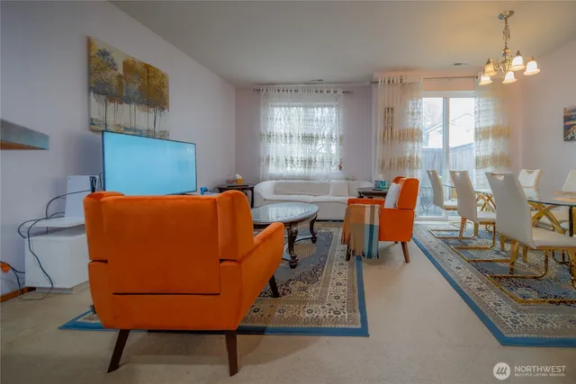 a view of a dining room with furniture and window