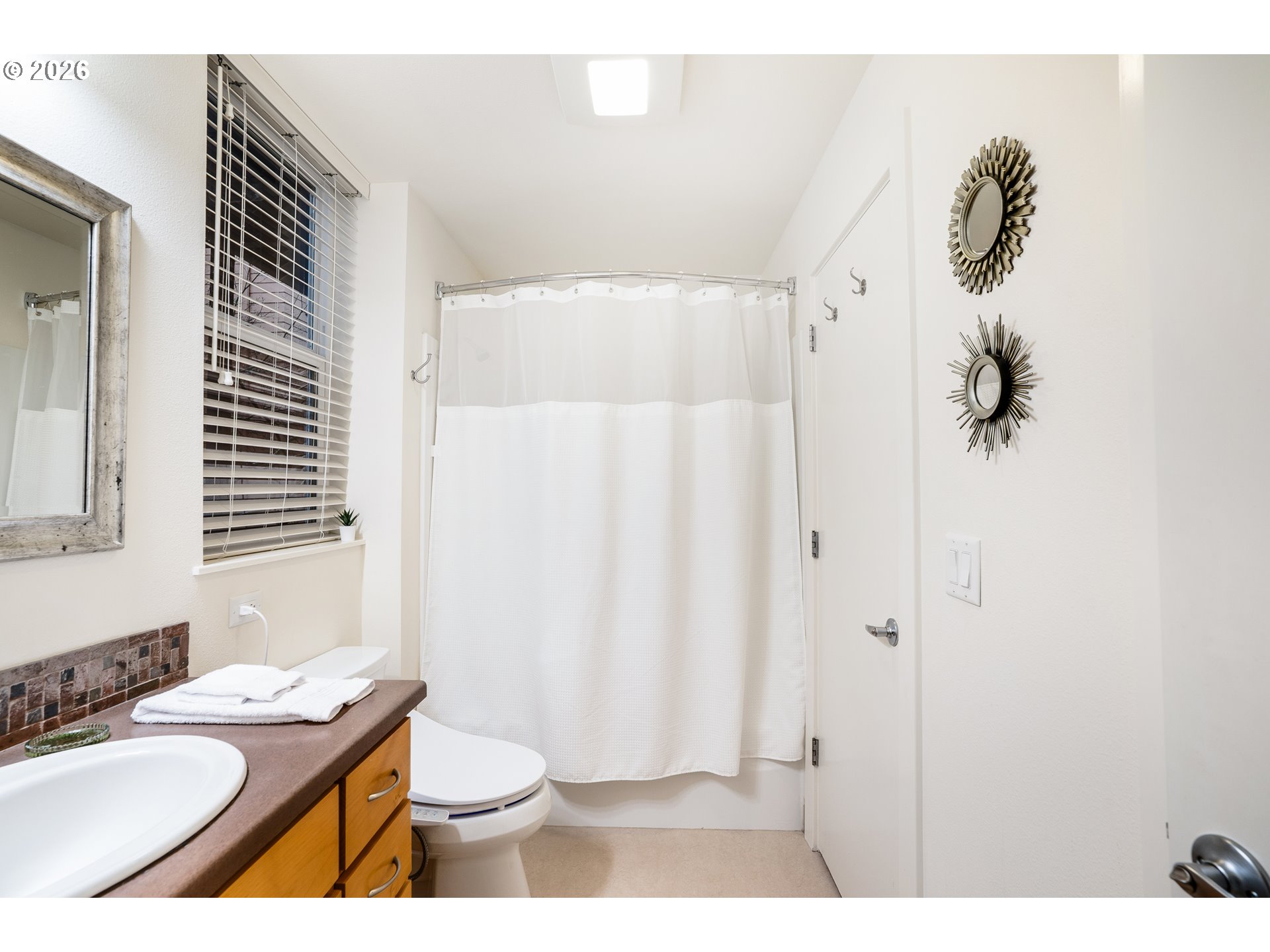 347 Rustic Place, Unit 14 Eugene, OR 97401 - Photo 8 of 20 a bathroom with a sink toilet and shower
