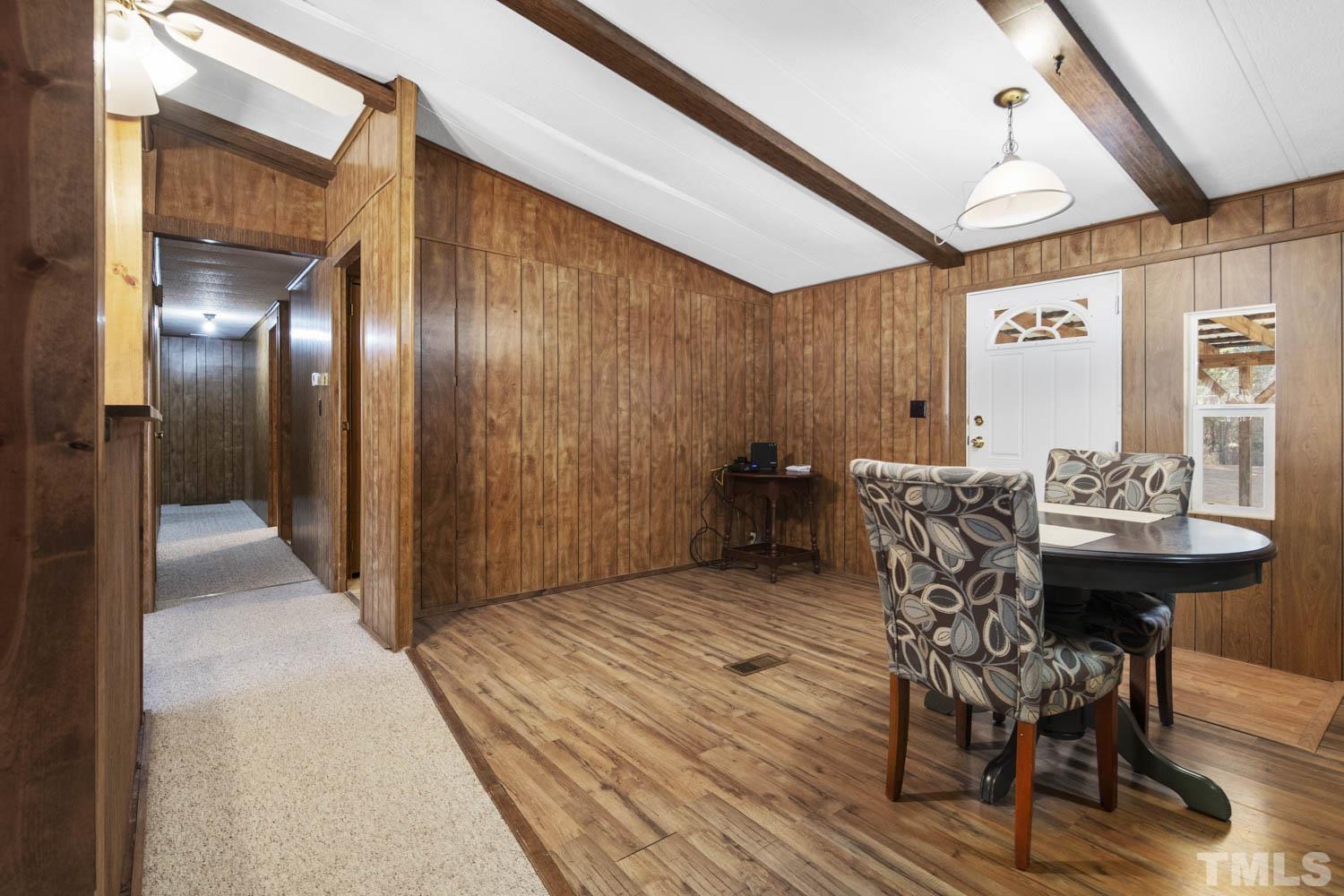 768 Wise Road Dunn, NC 28334 - Photo 14 of 28 a view of a dining room with furniture and wooden floor