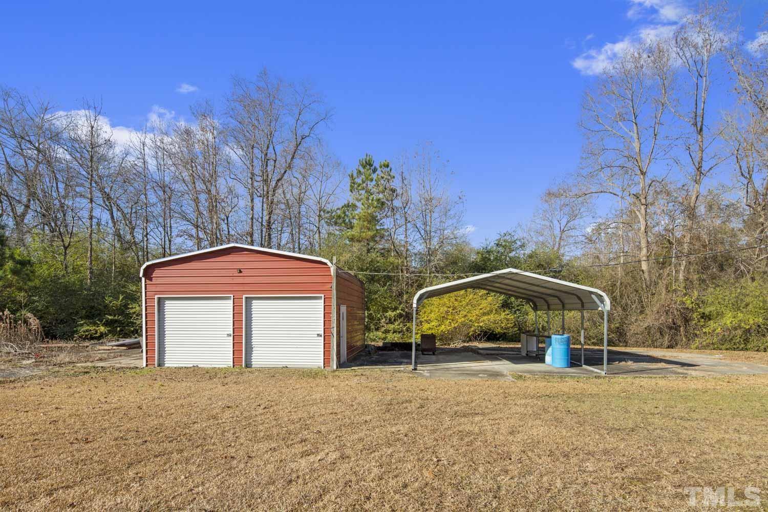 768 Wise Road Dunn, NC 28334 - Photo 8 of 28 a front view of a house with a yard and a garage