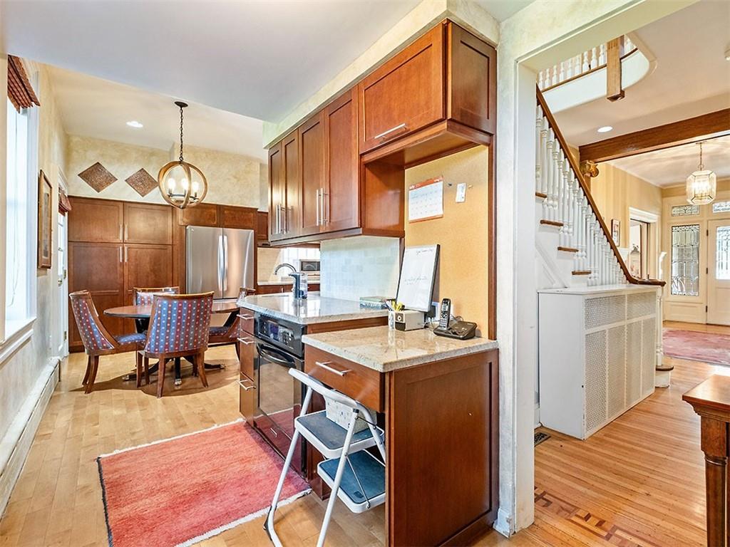 6417 Darlington Road Pittsburgh, PA 15217 - Photo 15 of 40 a room with chairs a dining table and chairs