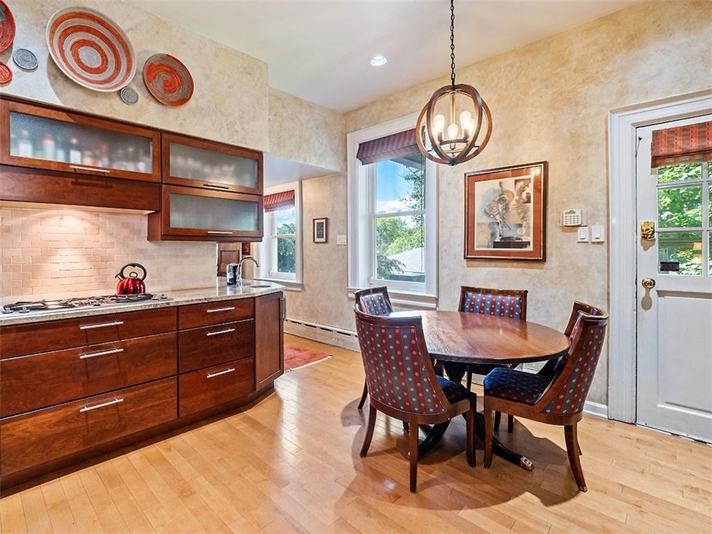 6417 Darlington Road Pittsburgh, PA 15217 - Photo 17 of 40 a view of a dining room with furniture window and wooden floor