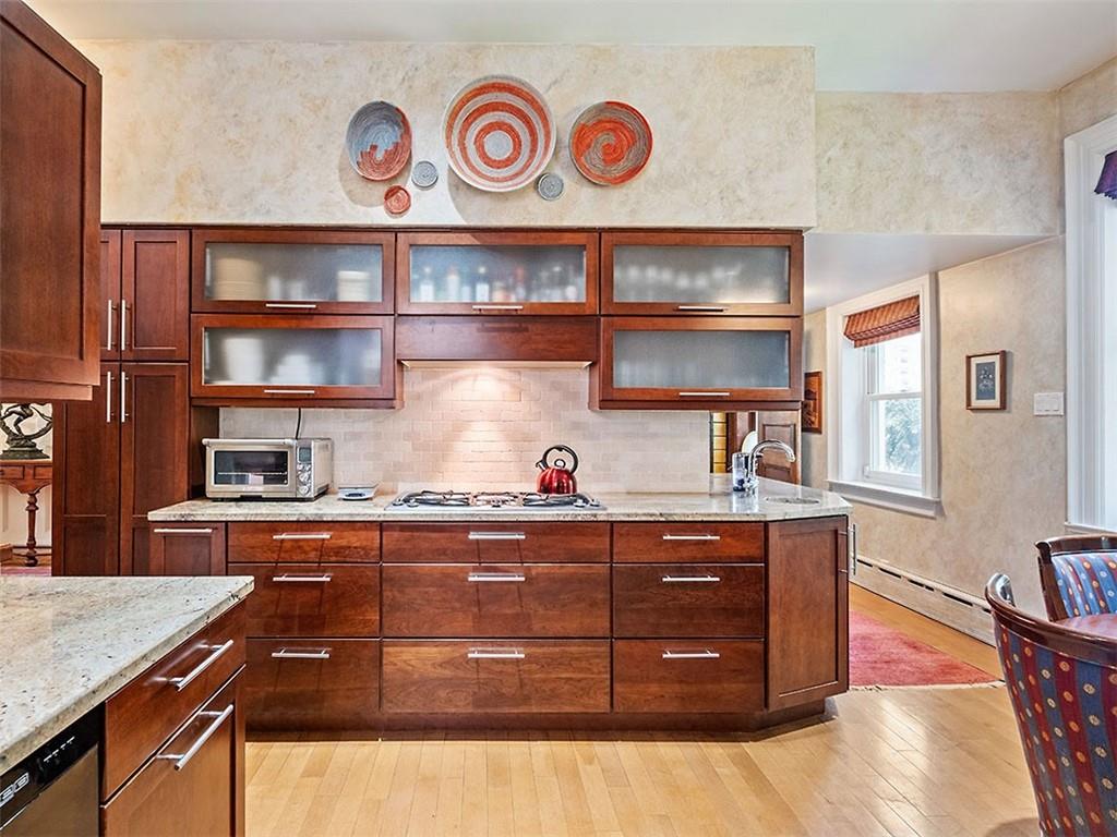 6417 Darlington Road Pittsburgh, PA 15217 - Photo 19 of 40 a kitchen with a cabinets and wooden floor