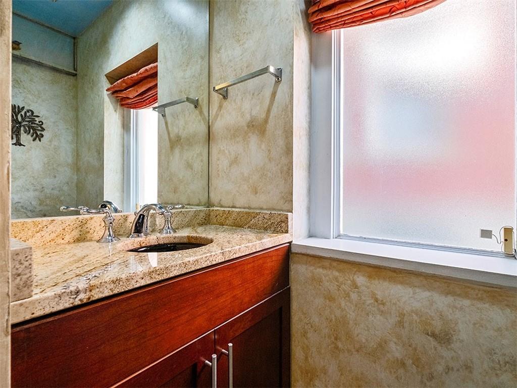 6417 Darlington Road Pittsburgh, PA 15217 - Photo 21 of 40 a bathroom with a granite countertop sink and a mirror