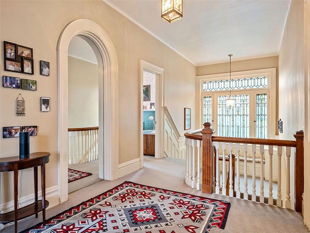 6417 Darlington Road Pittsburgh, PA 15217 - Photo 23 of 40 a view of a hallway with windows and stairs