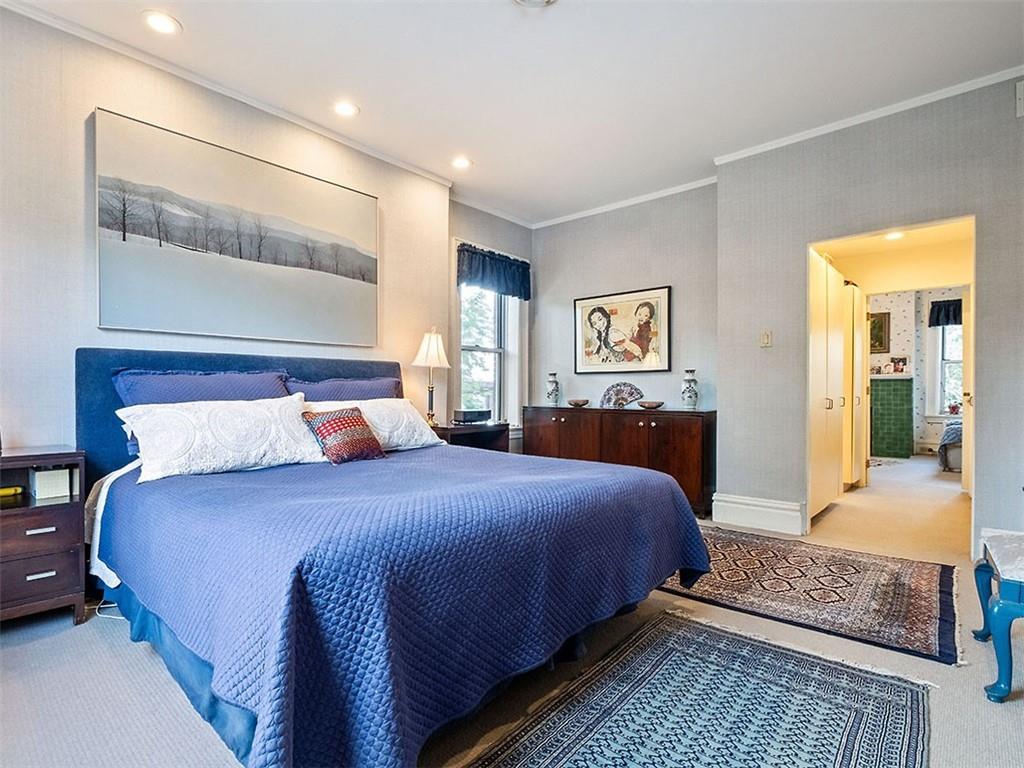 6417 Darlington Road Pittsburgh, PA 15217 - Photo 25 of 40 a bedroom with bed and a night stand