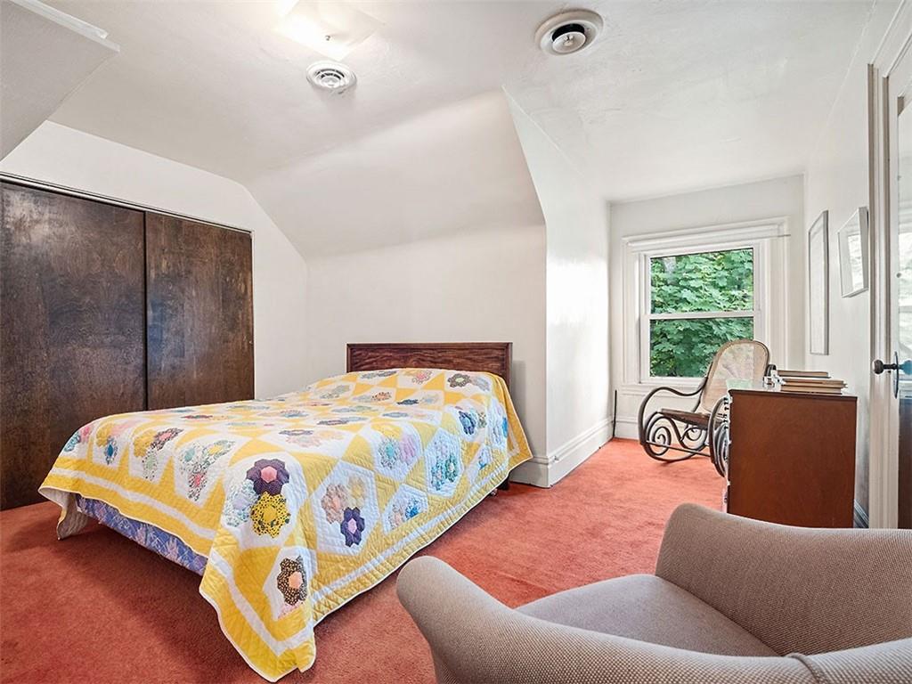 6417 Darlington Road Pittsburgh, PA 15217 - Photo 33 of 40 a bedroom with a bed and a couch