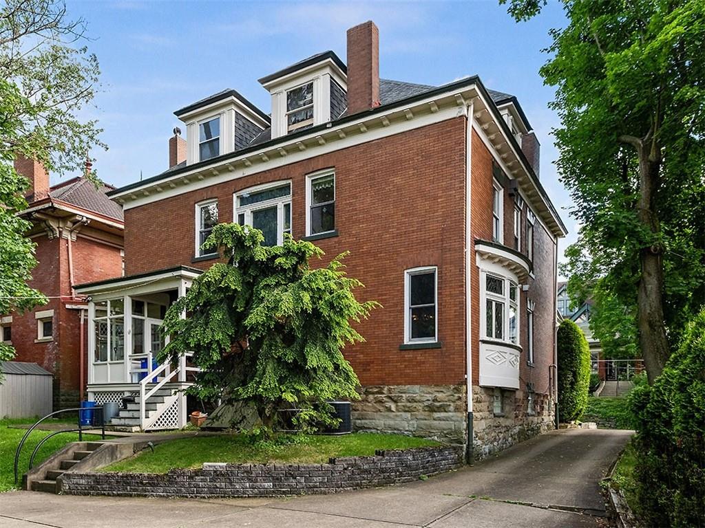 6417 Darlington Road Pittsburgh, PA 15217 - Photo 36 of 40 a view of a house with a yard and plants