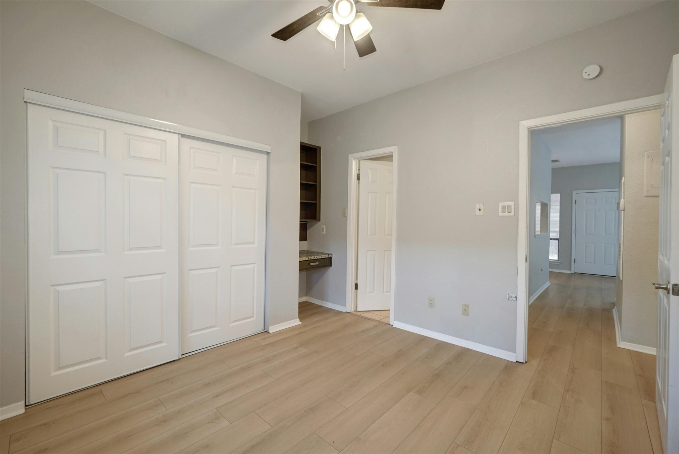 908 Poplar Street, Unit 103 Austin, TX 78705 - Photo 12 of 16 wooden floor in an empty room