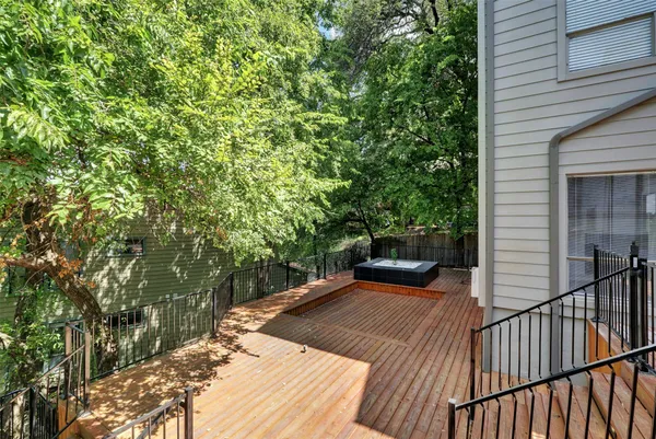 a view of a balcony with yard