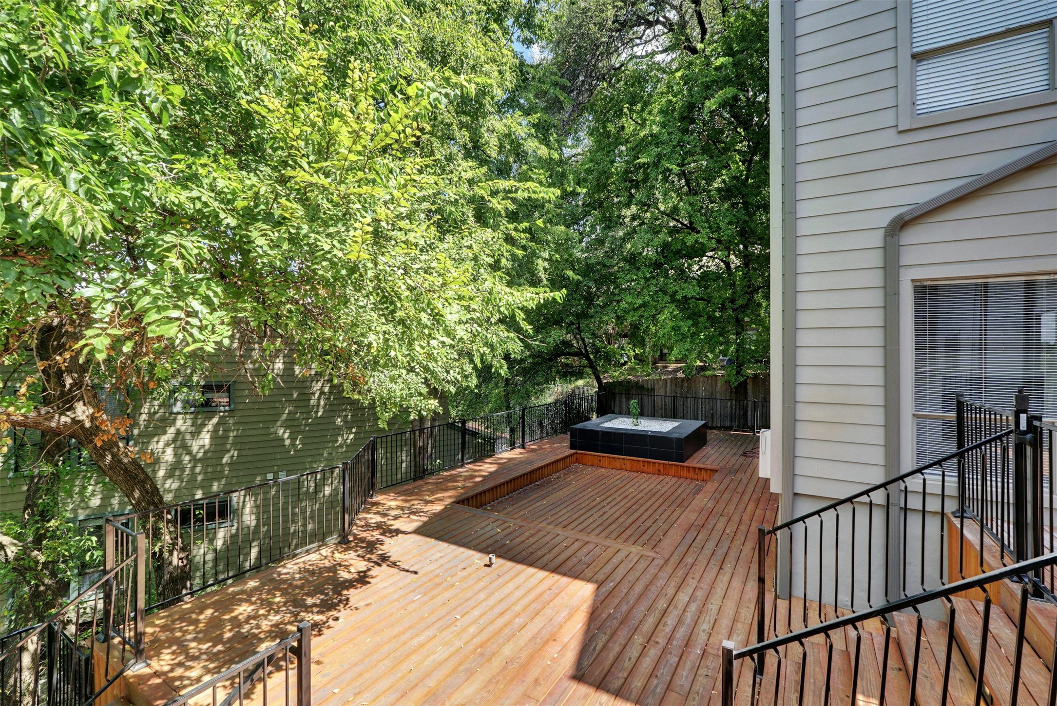 908 Poplar Street, Unit 103 Austin, TX 78705 - Photo 2 of 16 a view of a balcony with yard