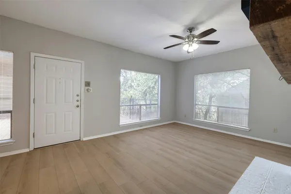 a view of an empty room with a window