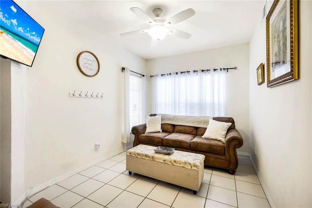 23810 Marbella Bay Road, Unit 103 Estero, FL 34135 - Photo 14 of 32 a living room with furniture and a window