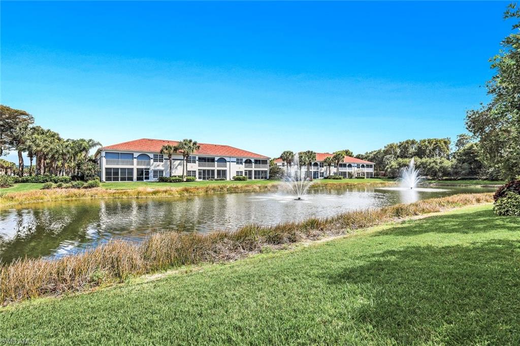 23810 Marbella Bay Road, Unit 103 Estero, FL 34135 - Photo 15 of 32 a view of a lake with houses