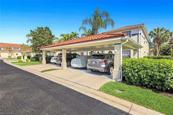 a view of a car park in front of house