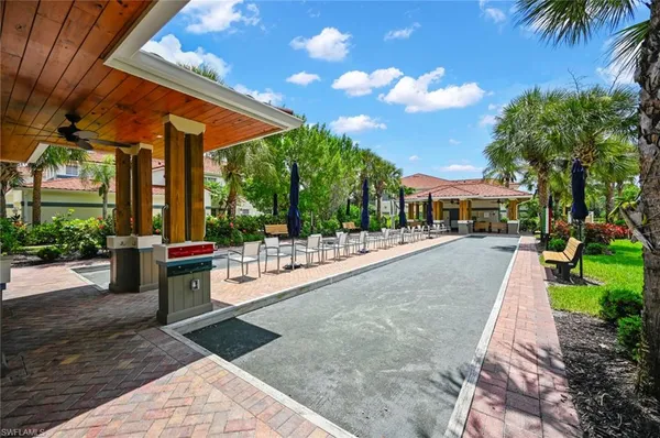 a swimming pool with outdoor seating and yard