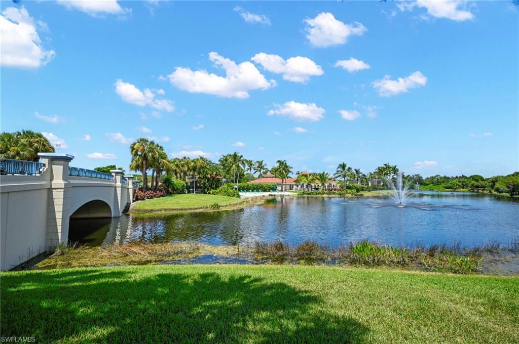 23810 Marbella Bay Road, Unit 103 Estero, FL 34135 - Photo 26 of 32 a view of a lake with houses in the back