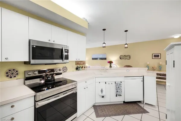 a kitchen with a sink and a stove top oven