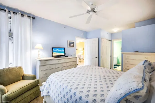 a bedroom with a bed and a couch