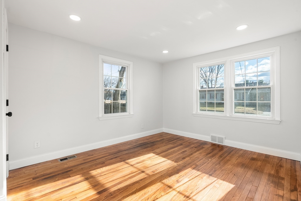 48 Beeler Avenue Chicopee, MA 01020 - Photo 14 of 30 a view of empty room with wooden floor and fan