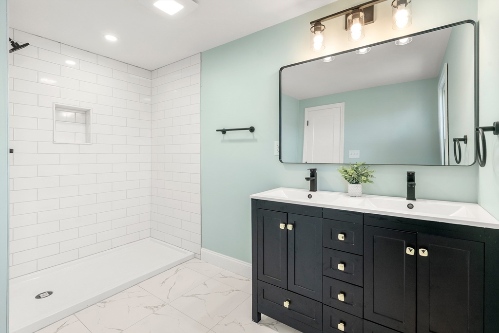 48 Beeler Avenue Chicopee, MA 01020 - Photo 16 of 30 a spacious bathroom with a granite countertop sink mirror and
