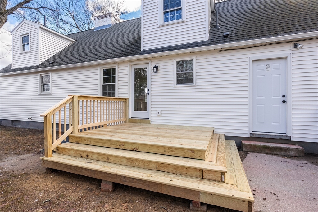48 Beeler Avenue Chicopee, MA 01020 - Photo 28 of 30 a view of a house with a balcony and wooden walls