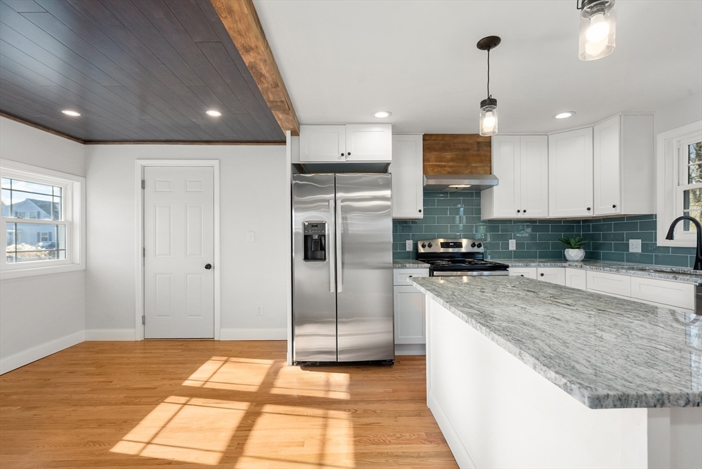 48 Beeler Avenue Chicopee, MA 01020 - Photo 7 of 30 a kitchen with stainless steel appliances granite countertop a refrigerator and a sink