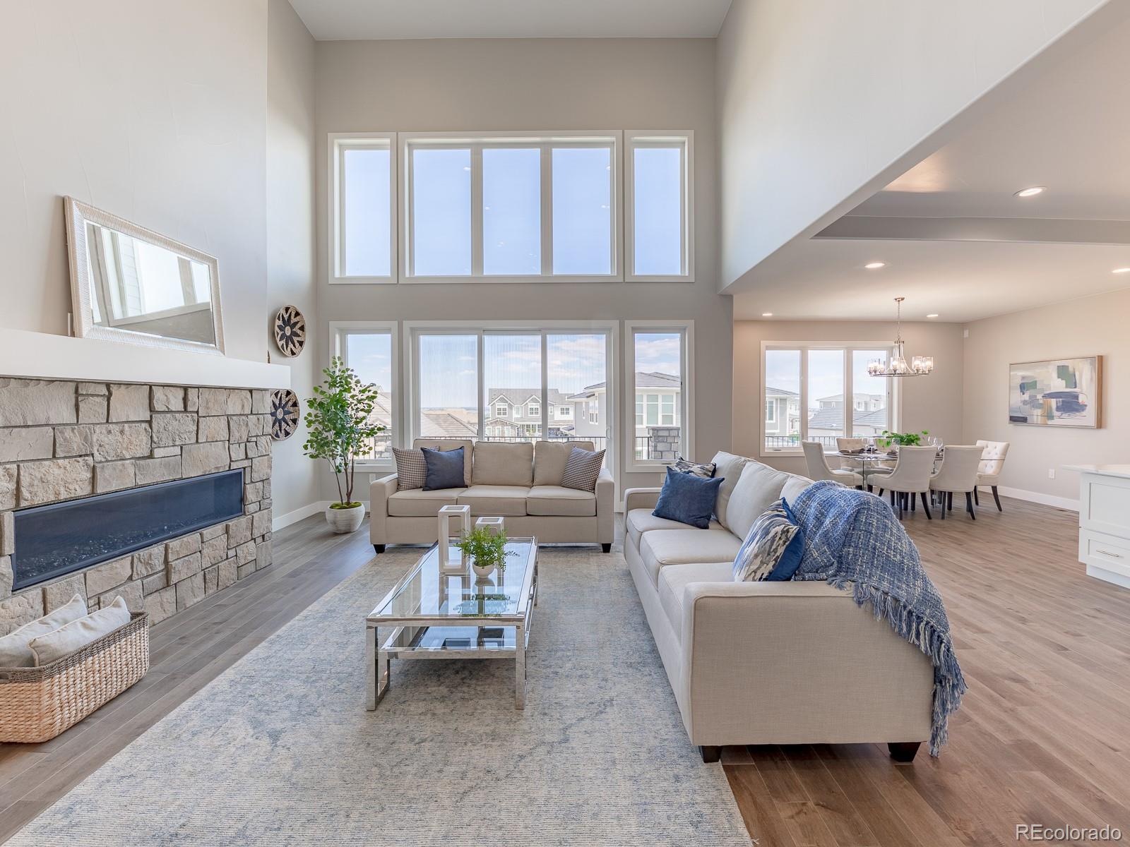 9540 Orion Way Arvada, CO 80007 - Photo 11 of 40 a living room with furniture and a large window