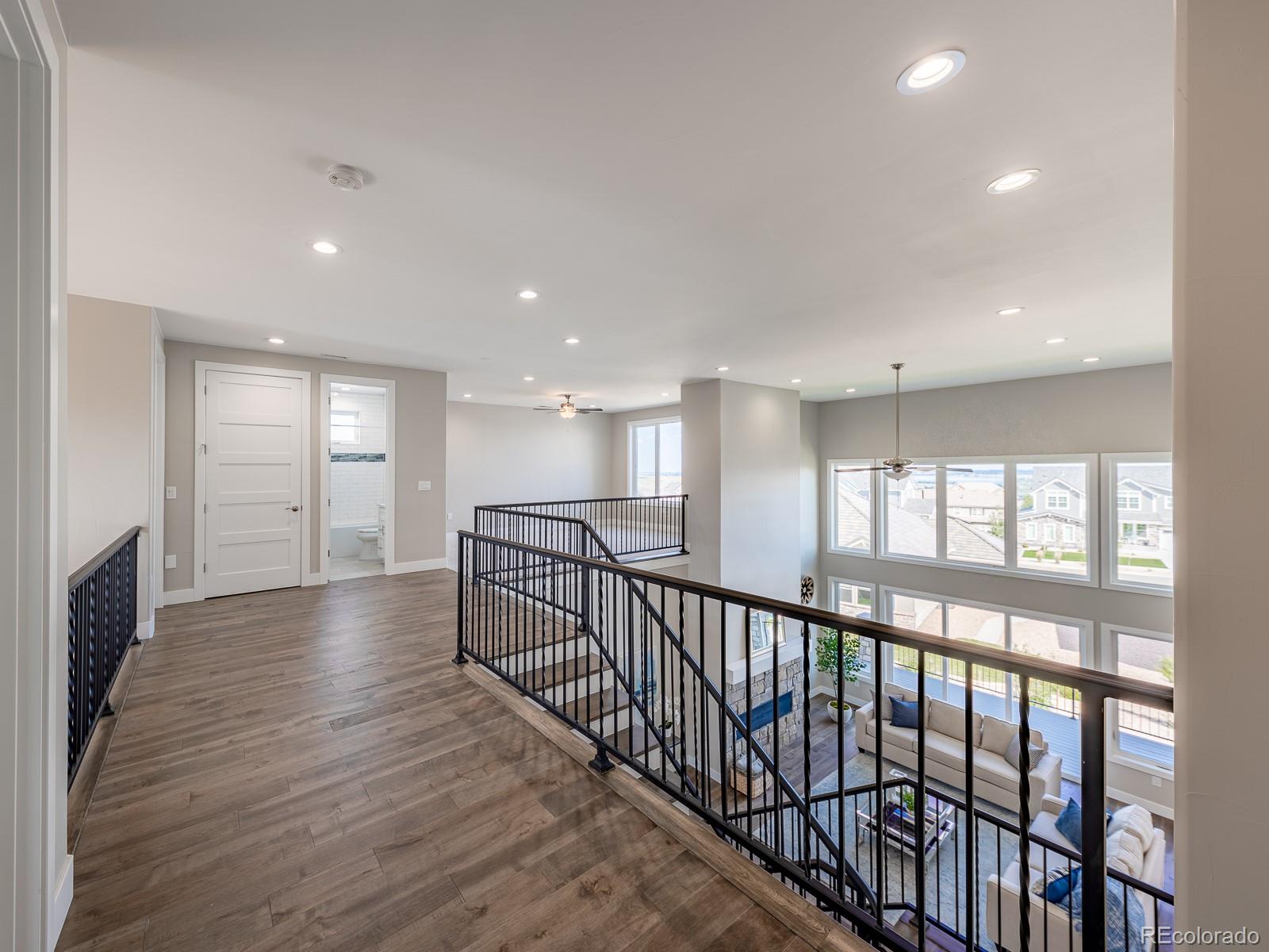 9540 Orion Way Arvada, CO 80007 - Photo 20 of 40 a view of a hallway with wooden floor
