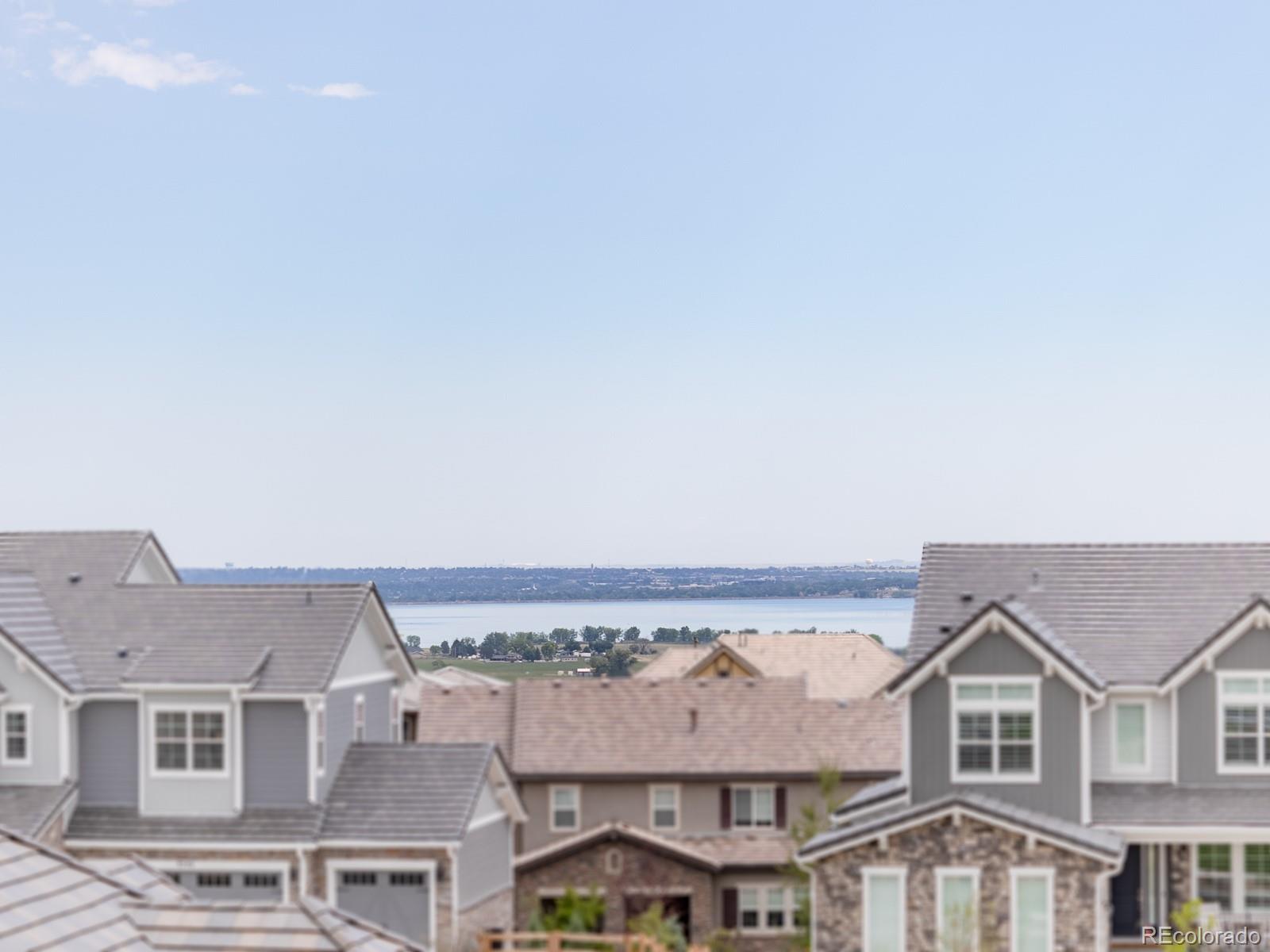 9540 Orion Way Arvada, CO 80007 - Photo 23 of 40 an aerial view of residential houses with an outdoor space