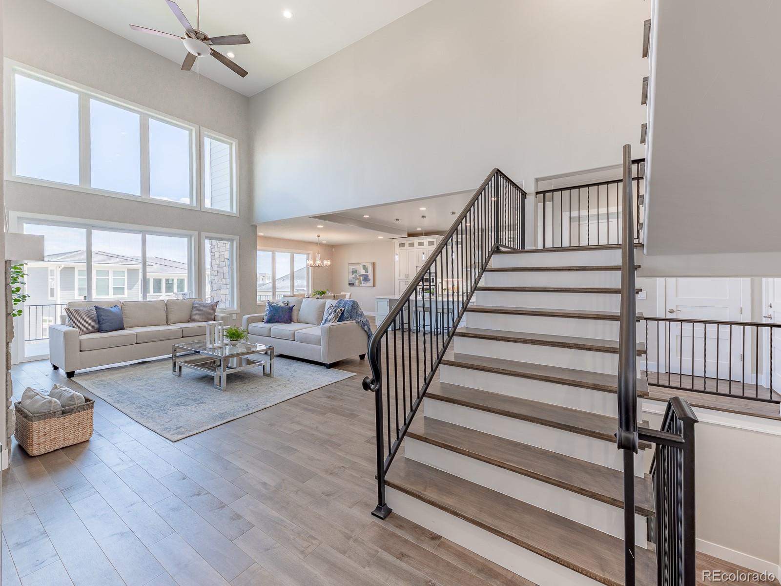 9540 Orion Way Arvada, CO 80007 - Photo 10 of 40 a living room with furniture and a table