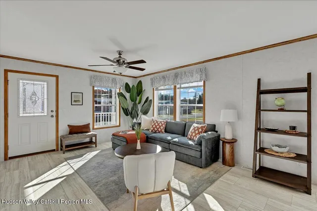 a living room with furniture and a large window