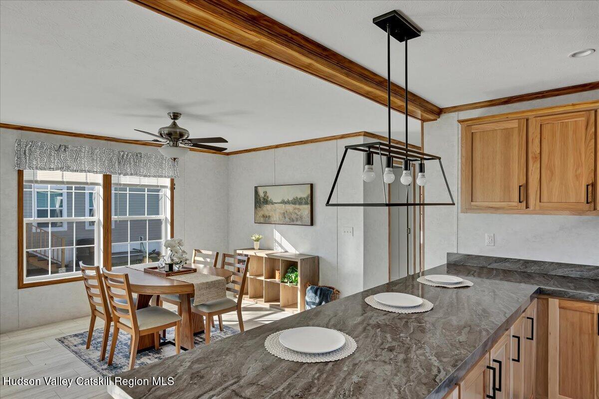 299 Hyspot Road, Unit 4C Greenfield, NY 12833 - Photo 21 of 41 a dining room with furniture and window