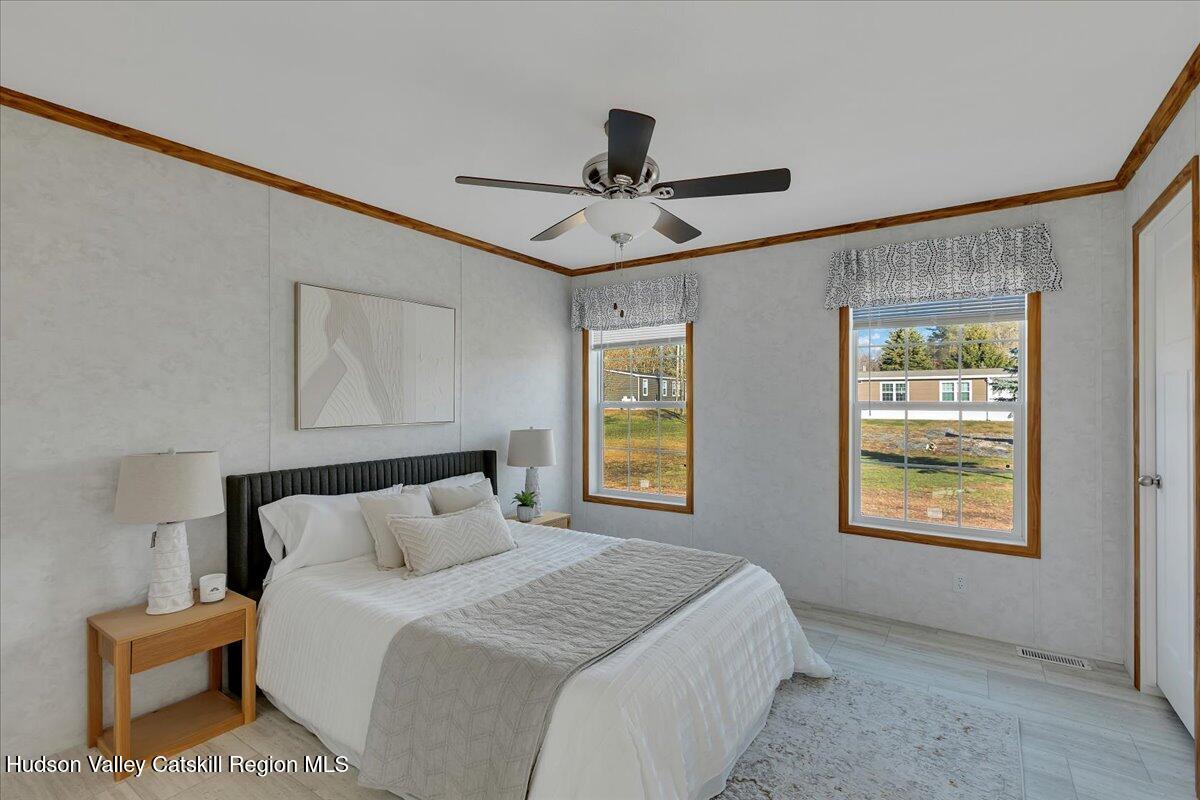 299 Hyspot Road, Unit 4C Greenfield, NY 12833 - Photo 25 of 41 a bedroom with a bed and a window